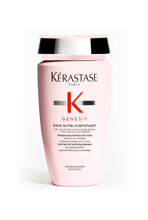 Bottiglia rosa opaca dello shampoo Kerastase Genesis Bain Nutri-Fortifiant per capelli secchi e indeboliti.
