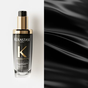 El huile Chronologiste Kerastase se coloca sobre una superficie blanca.