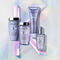 A collection of Kerastase hair care products displayed elegantly on a iridescent background. The products include a shampoo, conditioner, a treatment, and a serum, all presented in sleek packaging with a lavender theme.