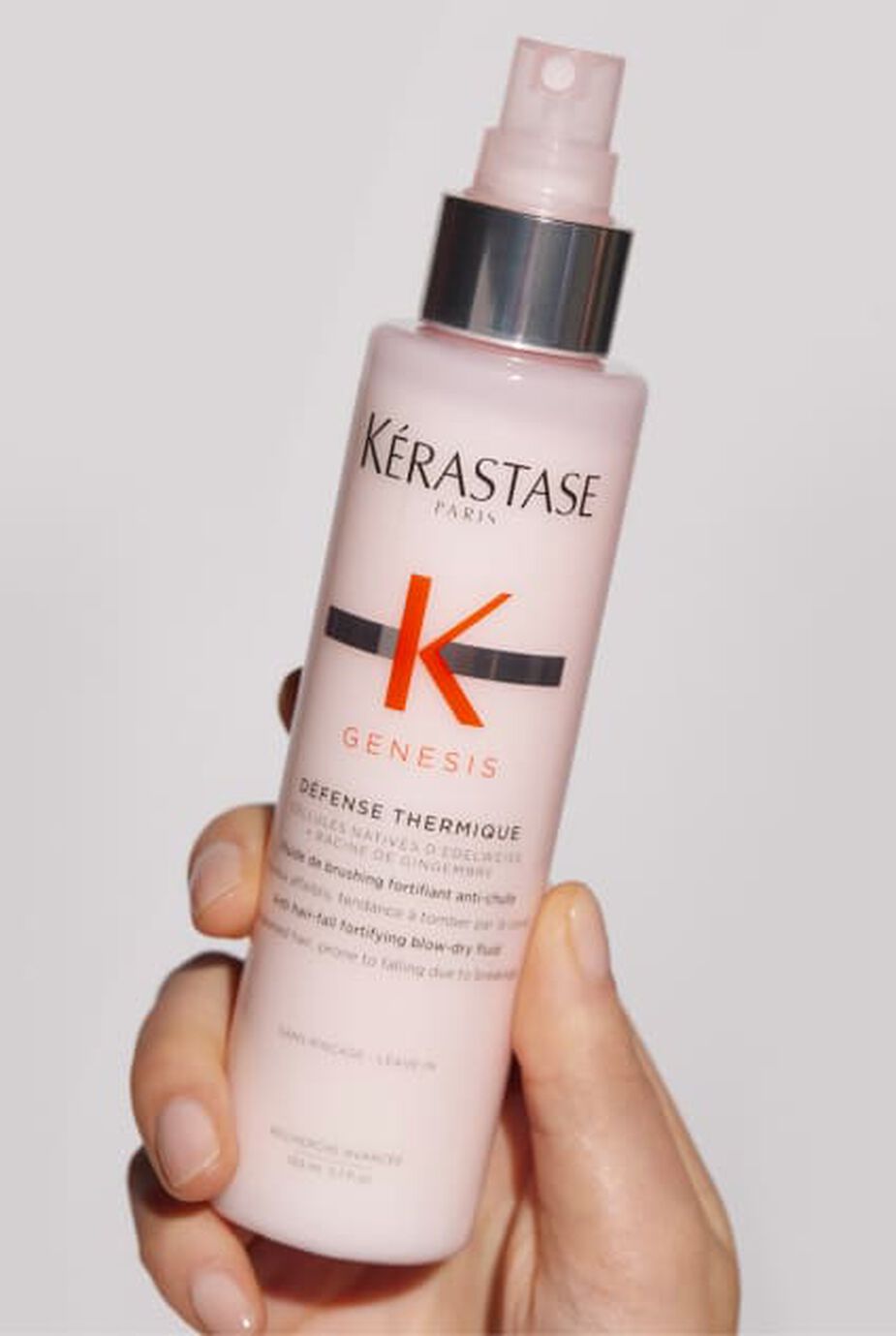 Bottiglia rosa di Kerastase Genesis Defense Thermique, un trattamento termoprotettivo per capelli.