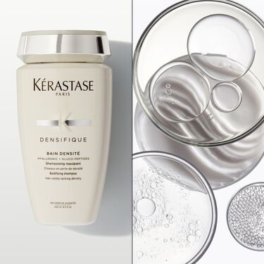 El bain densite Densifique Kerastase se coloca sobre una superficie blanca.
