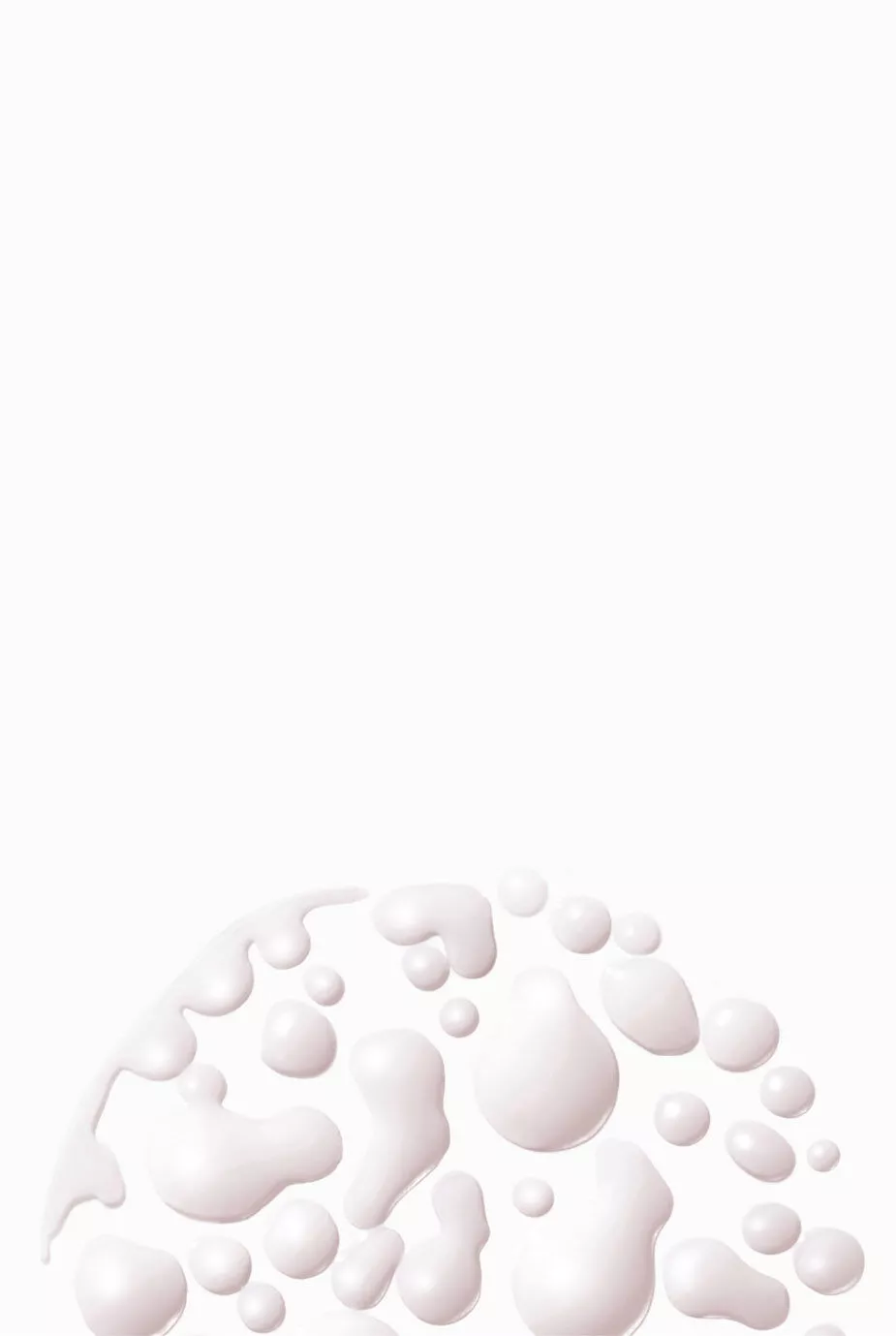 Immagine astratta di gocce bianche su uno sfondo chiaro, creando un effetto di fluidita e leggerezza.