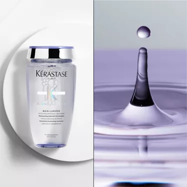 Il bain blond absolu Kerastase e posizionato su un supporto rotondo bianco.